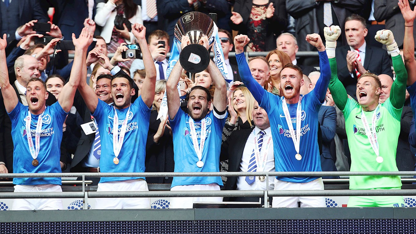 Brett Pitman lifts the Checkatrade Trophy for Pompey at Wembley
