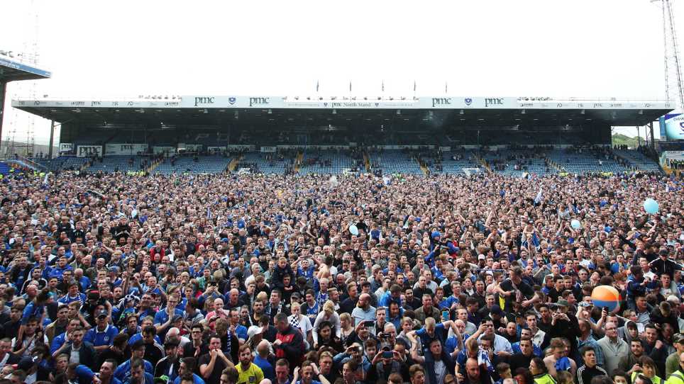 Pompey fans on the pitch after League Two title win