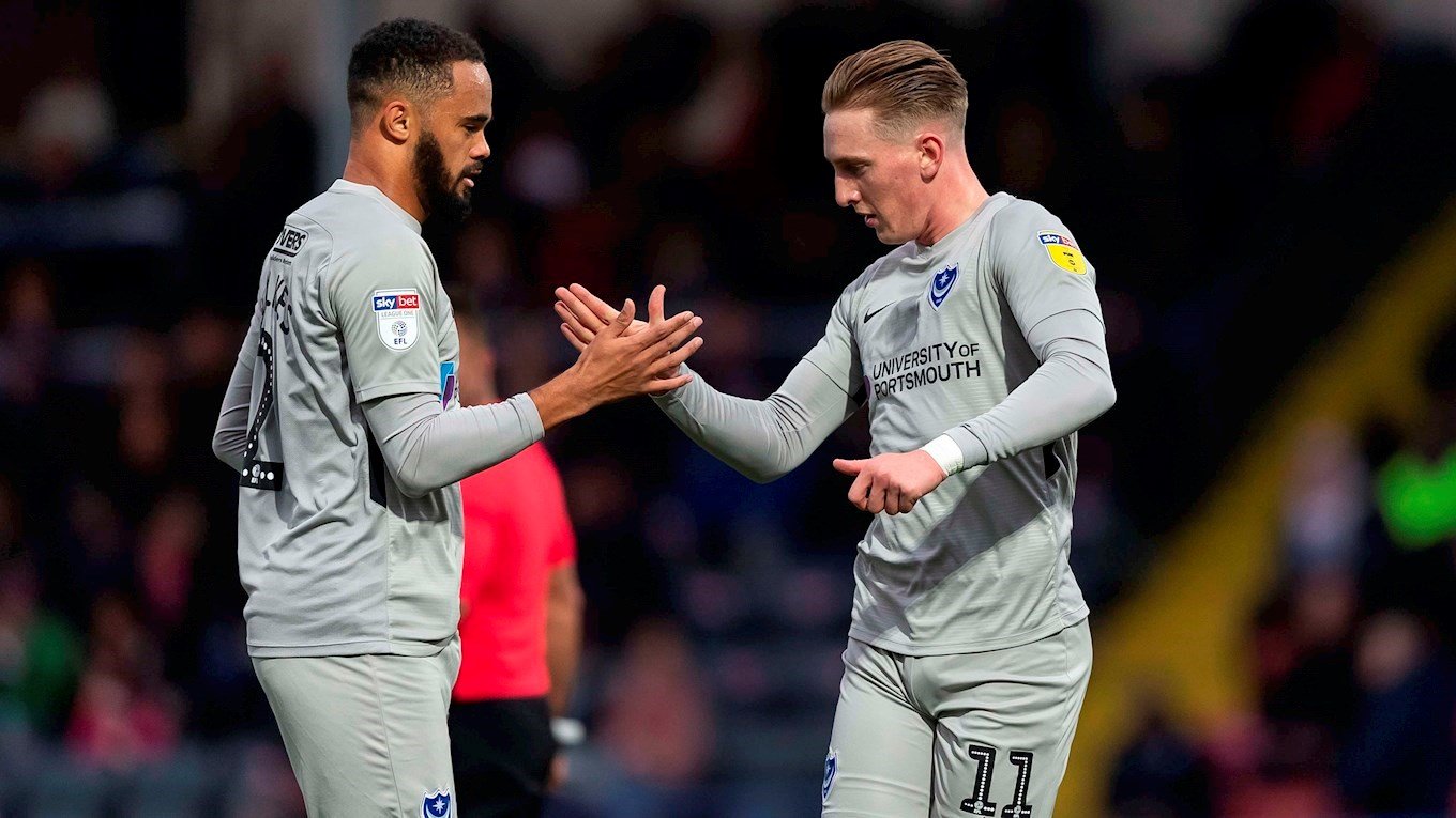 Ronan Curtis celebrates with Anton Walkes after scoring for Pompey at Rochdale