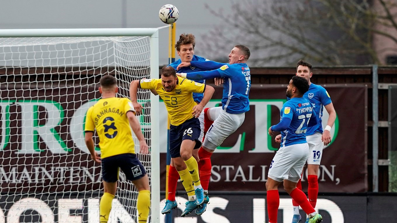 Sean Raggett clears the ball for Pompey against Oxford United in League One