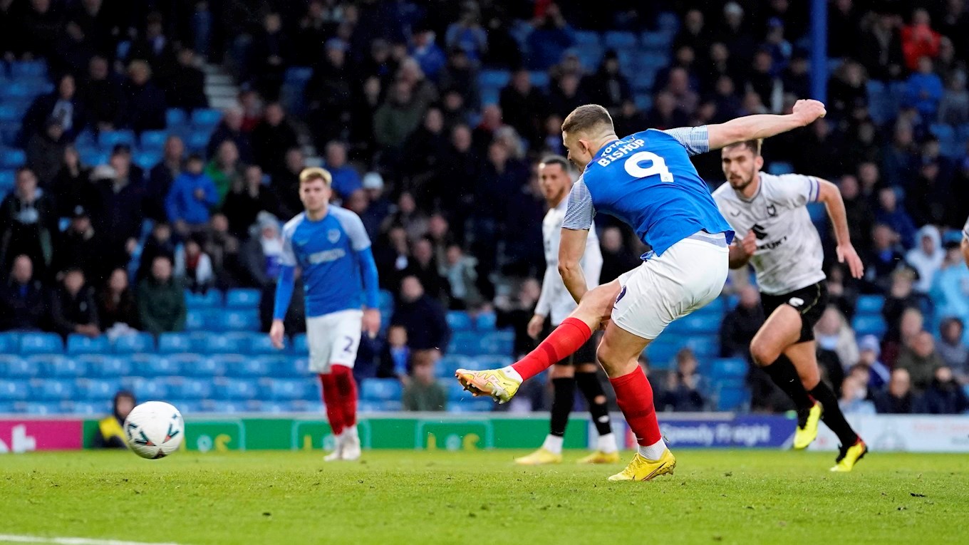 Colby Bishop scores a penalty for Pompey in Emirates FA Cup tie wth MK Dons at Fratton Park