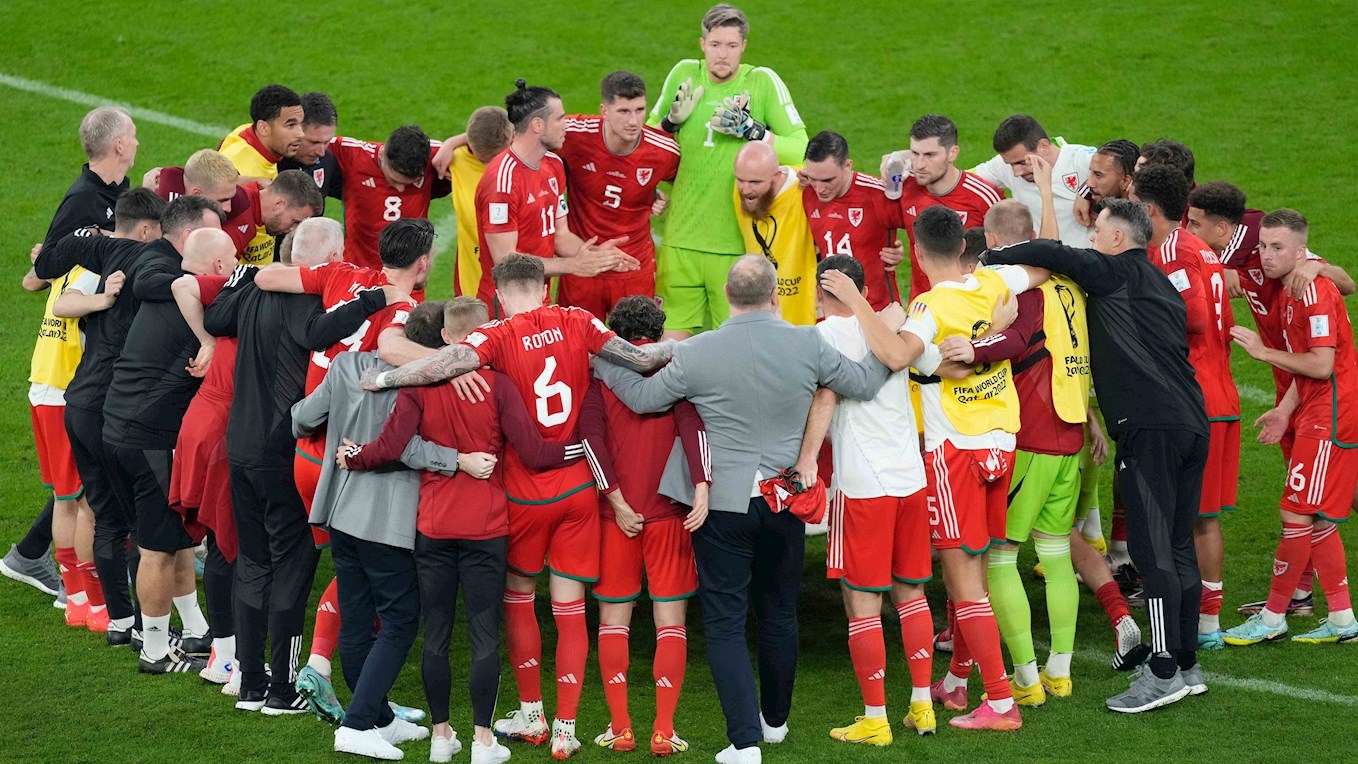 Joe Morrell joins the Wales huddle after World Cup opener against USA