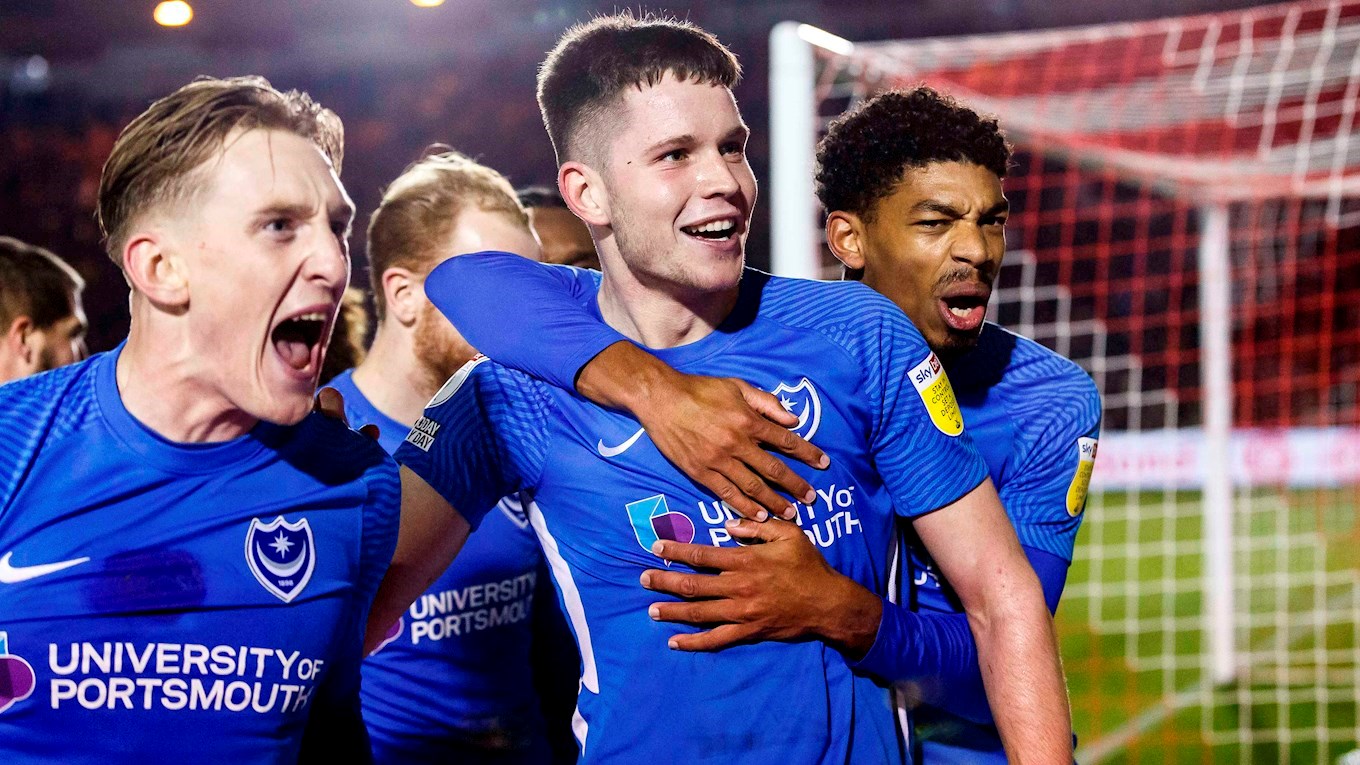 George Hirst celebrates scoring for Pompey at Lincoln