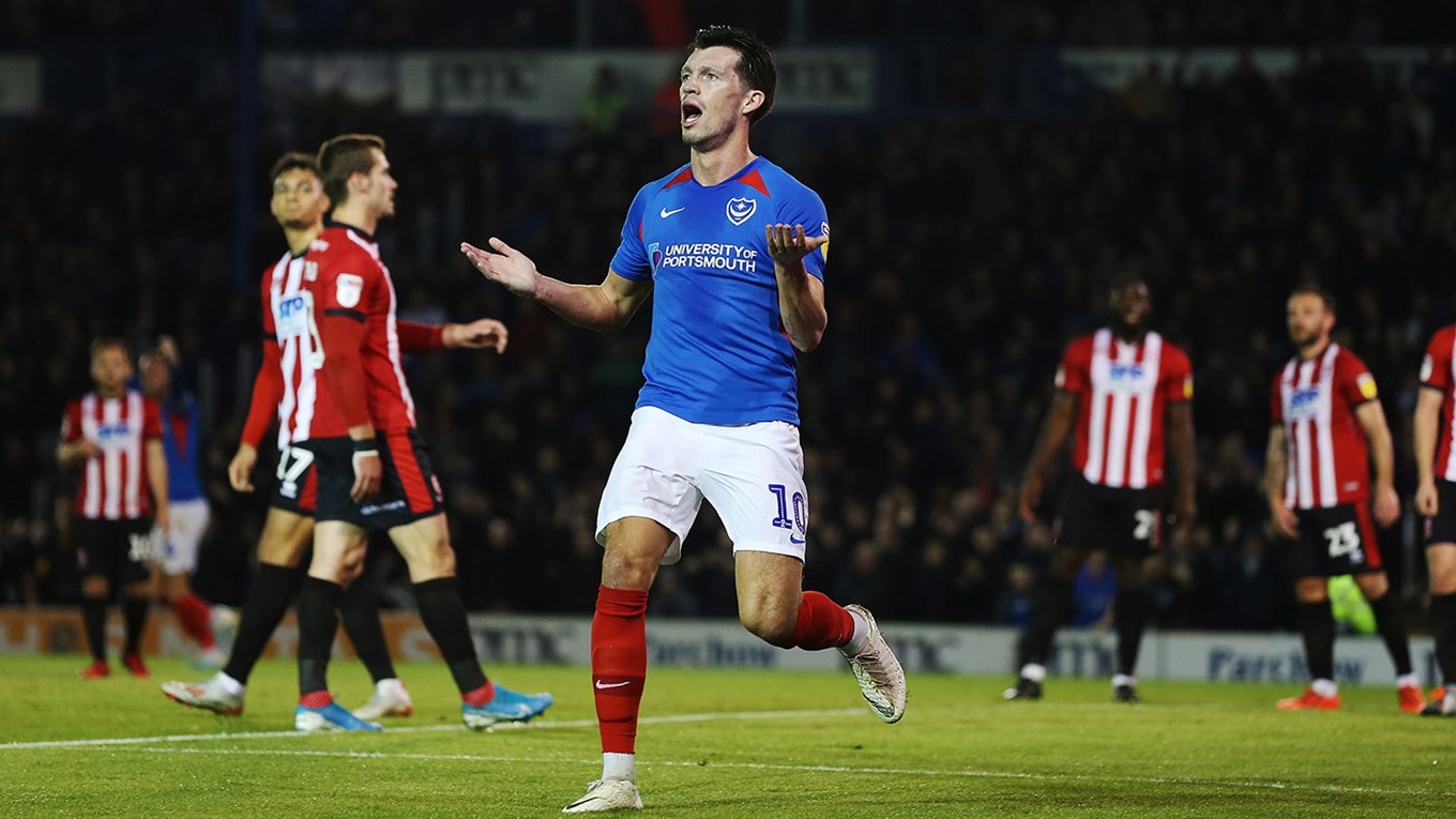 John Marquis celebrates scoring for Pompey against Lincoln