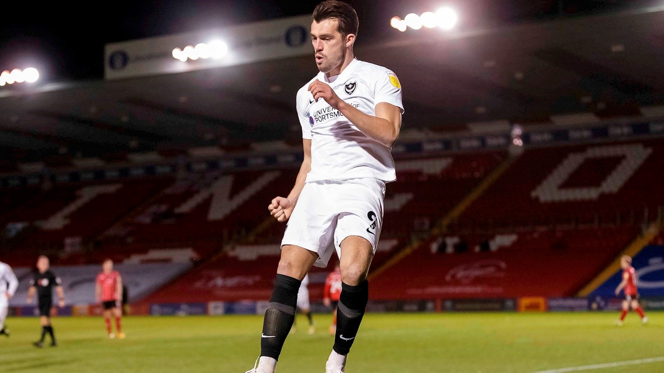 John Marquis celebrates scoring for Pompey at Lincoln