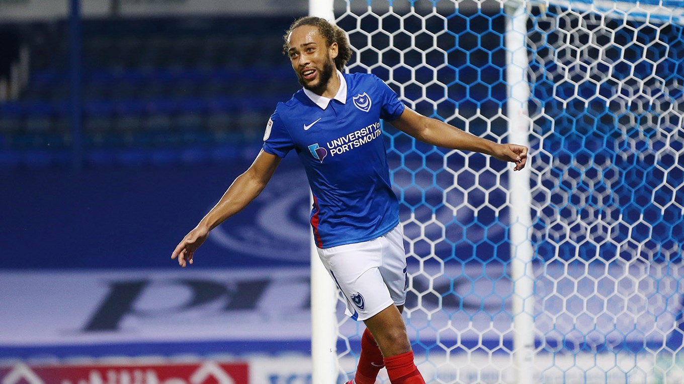 Marcus Harness celebrates scoring for Pompey against Colchester in the EFL Trophy