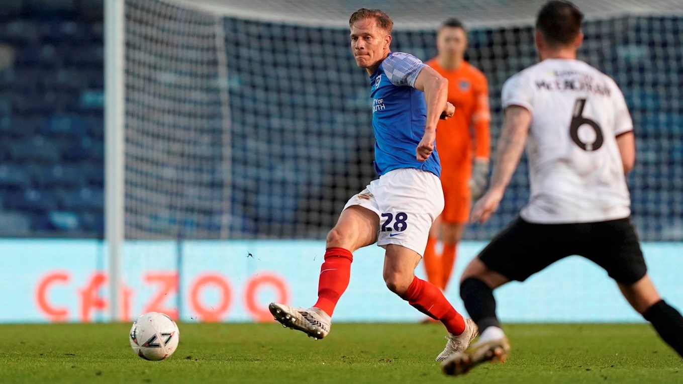 Michael Morrison in Emirates FA Cup action for Pompey against MK Dons at Fratton Park