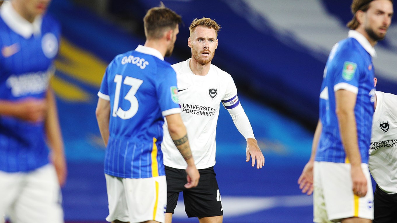 Tom Naylor in Carabao Cup action for Pompey at Brighton