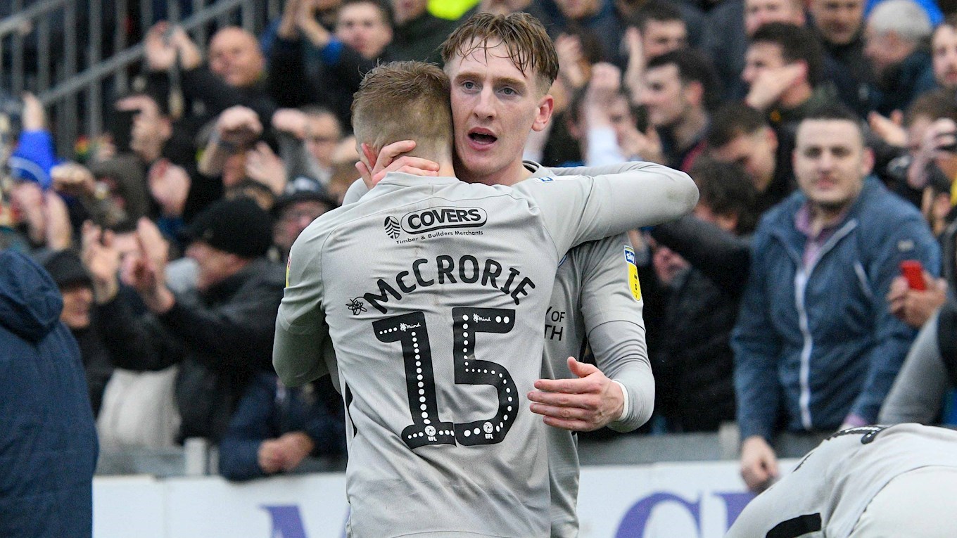 Ronan Curtis celebrates with Ross McCrorie after scoring for Pompey at Bristol Rovers