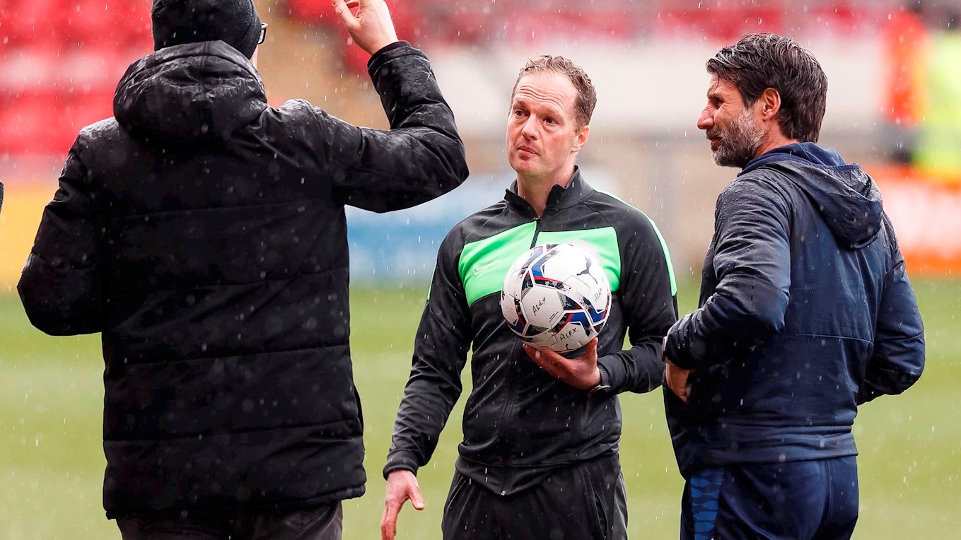 Danny Cowley and David Artell speak to referee Martin Coy at Crewe