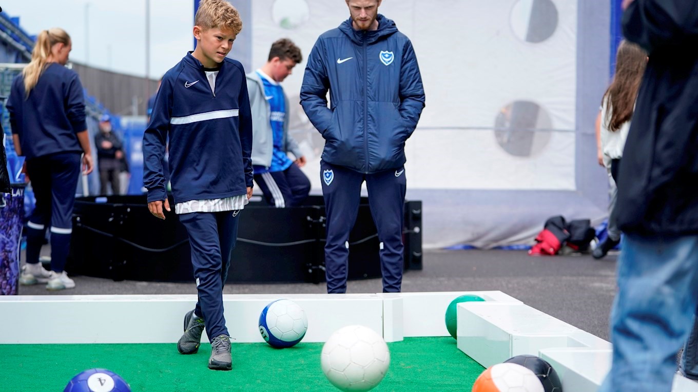 A supporter playing FootPool at Fratton Park